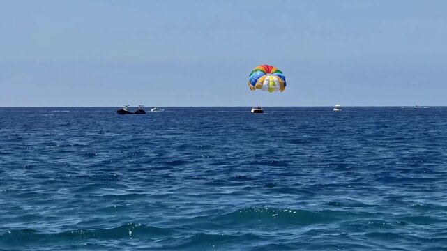 Experience the exhilarating adventure of parasailing high above the stunning and breathtaking ocean backdrop