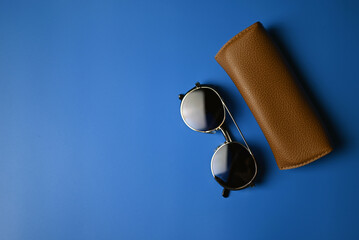 vintage sunglasses on blue background