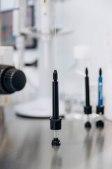 A young scientist working at a medical clinic conducts experiments in a laboratory.