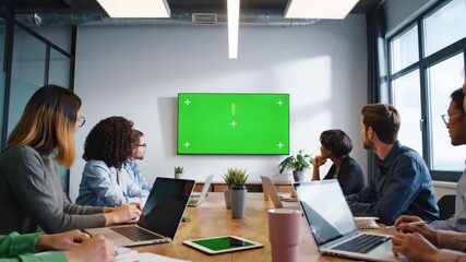 Diverse Business Team Meeting in Modern Conference Room with Green Screen Display and Tracking Markers for Custom Content