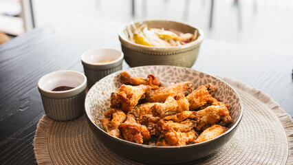 Golden-brown crispy fried chicken served with a fresh side salad bowl and creamy dipping sauce. Perfectly styled for food photography, highlighting texture and balance. Ideal for menus, blogs, and soc