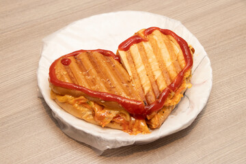 Cheesy Heart Shaped Sub Sandwich with Ketchup on a Plate side view of bangladeshi food