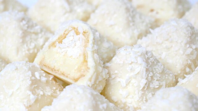 Candy wrapped in coconut chips. A delicious dessert of crispy waffles, sweet, delicate cream sprinkled with coconut chips