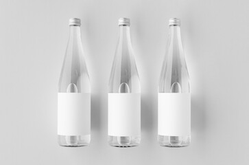 Water bottle mockup with blank label, clear glass
