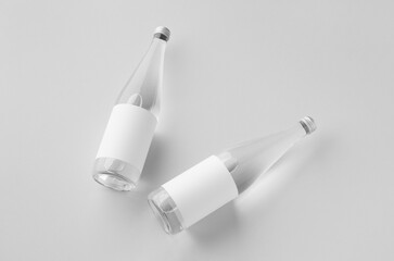 Water bottle mockup with blank label, clear glass