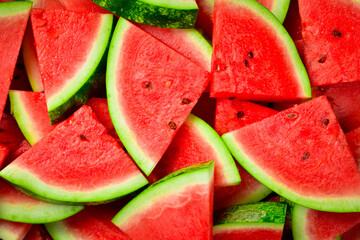 Triangles of sliced watermelon close-up. Watermelon pattern, macro photo. Close-up.