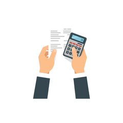 Hands holding a calculator and reviewing financial documents.