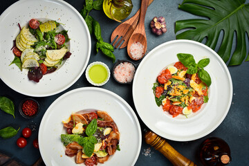 view from above of salads and food on plates. Healthy meal. Top view.