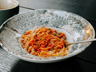 Delicious pasta dish served in an elegant bowl during a cozy dining experience
