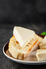 Processed cheese spread portion size cheese for sandwich tasty snack fresh delicious gourmet food background on the table rustic food top view copy space