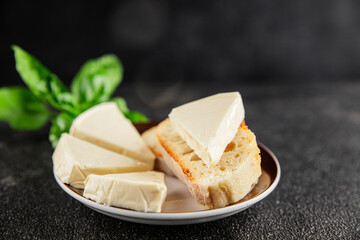 Processed cheese spread portion size cheese for sandwich tasty snack fresh delicious gourmet food background on the table rustic food top view copy space