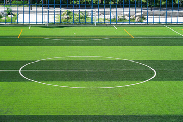 Fototapeta premium Artificial grass at football field with&nbsp;lines marking on the playing area.