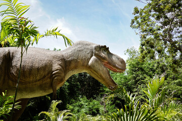 Pattaya​ Dinosaur Kingdom- 8th June 2025: A large dinosaur statue,life-size Tyrannosaurus Rex (T-Rex) model at Chonburi Province,Thailand.