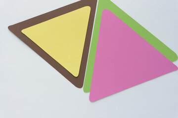 machine-cut paper triangles layered and arranged on blank paper