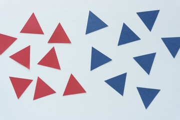 red and blue triangles on blank paper