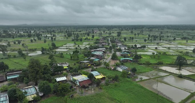 Aerial view of a village surrounded by agricultural fields near the Bhopal-Nagpur highway in Madhya Pradesh during the monsoon season.