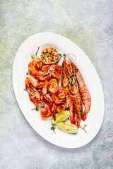 fried langoustines and tiger shrimps, with spices and herbs, homemade dish, without people,
