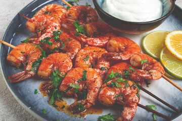 Fried shrimp, without a head, on skewers, shrimp kebabs, with spices, grilled, homemade, without people,