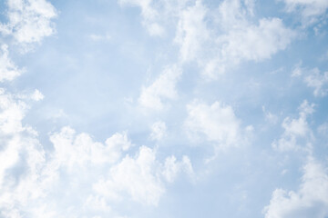 Scenic sky with soft white cumulus clouds on blue background, symbolizing freedom and freshness. Fluffy clouds wallpaper ideal for web design, posters, nature themes and inspirational content.