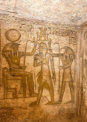 Pharaoh and deities relief at Abu Simbel temple, Egypt