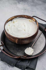 Mascarpone Italian cream cheese in wooden bowl. white background. top view