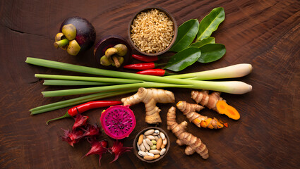 Culinary Fusion: An exquisite collection of fresh herbs and vibrant ingredients on a dark wood surface, showcasing a visually captivating array of nature's bounty.
