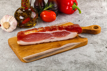 Piece prosciutto crudo over board