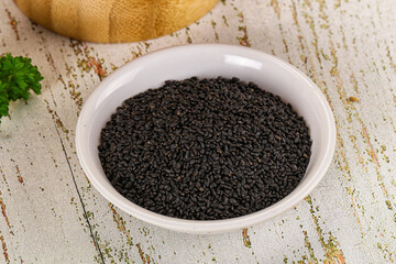 Black dry Nigella seeds in the bowl