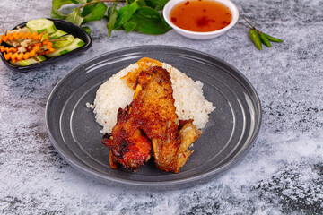 Spicy roasted chicken wing with rice