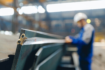 Industrial shipyard worker measuring steel with tape in cargo industry port, Technical Control...