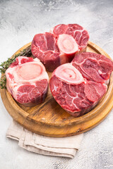 Beautifully marbled raw veal ossobuco, perfect cross cut shank meat for traditional Italian recipes and savory family dinners. white background. top view