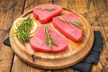 High quality raw tuna steak loin, perfect for a refreshing poke bowl or a delicious seared dish that impresses every time. wooden background. top view