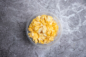 Spicy Mashed Egg with Onions in bowl top view of a Traditional and Delicious Dim Bhorta