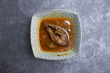 Spicy Hilsa Fish Curry in a Decorative Bowl top view of a Classic Bengali Ilish Bhuna