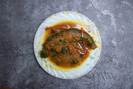 Pabda Fish Bhuna in plate top view of Traditional Bengali Fish Curry with a Rich Gravy