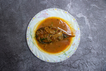 Pangash Fish Bhuna in plate top view of Traditional Bengali Fish Curry with a Rich Gravy