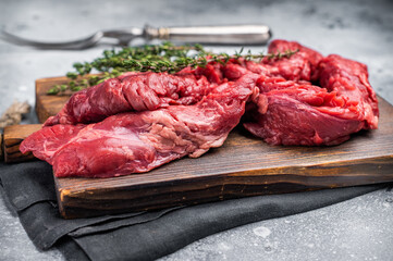 Uncooked Beef Skirt Steak, also name Machete steak, raw meat on cutting board. grey background. top view
