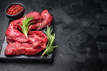 Raw Beef Machete Steak, also name Skirt steak, fresh marble meat. black background. top view