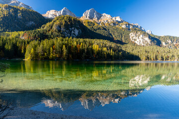 Fototapeta premium Italy, Trentino, Lago di Tovel - 24 October 2021 - The crystal-clear Lake Tovel and the fantastic Trentino woods