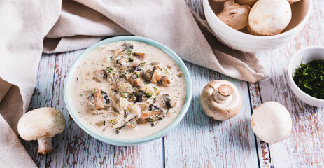 Spicy mushroom sauce with herbs in a bowl on the table web banner