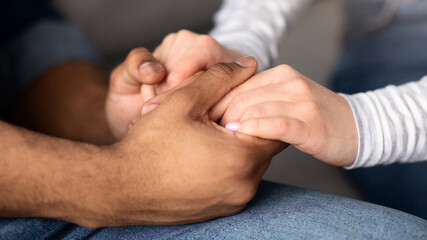 Cropped Image Of Romantic Interracial Couple Holding Hands Together, Closeup Shot Of African...