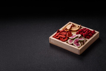 Box of dried fruits strawberries, raspberries, figs and peaches. Dried fruits