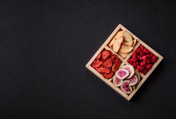 Box of dried fruits strawberries, raspberries, figs and peaches. Dried fruits