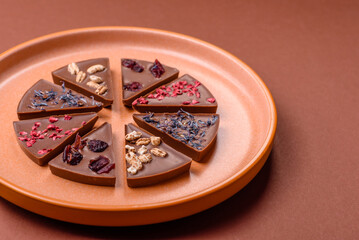 Craft home made chocolate with berries and fruits, delicious sweets. Craft chocolate
