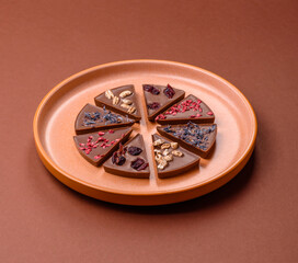 Craft home made chocolate with berries and fruits, delicious sweets. Craft chocolate