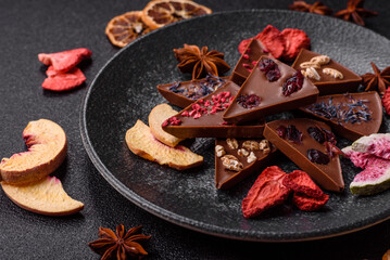 Craft home made chocolate with berries and fruits, delicious sweets. Craft chocolate