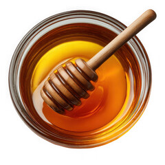 Golden honey dripping from wooden dipper into jar close-up top down view