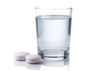 Glass of water with two effervescent tablets isolated on transparent background