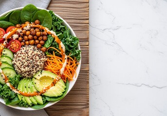A vibrant and colorful Buddha bowl filled with fresh spinach, kale, quinoa, chickpeas, avocado, carrots, cucumber, and tomatoes, drizzled with sauce.