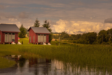 Fototapeta premium Vocation in camping, located near lake with forest in Latvia.
